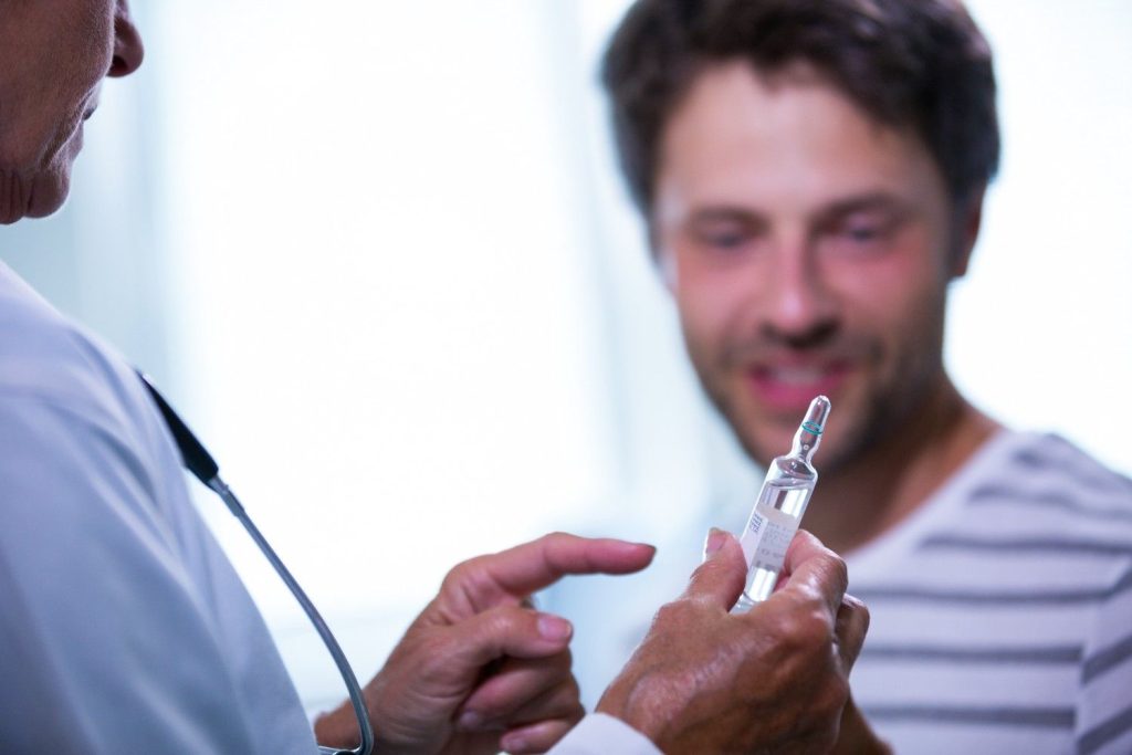 doctor-showing-injection-to-patient by Nameen Infusion